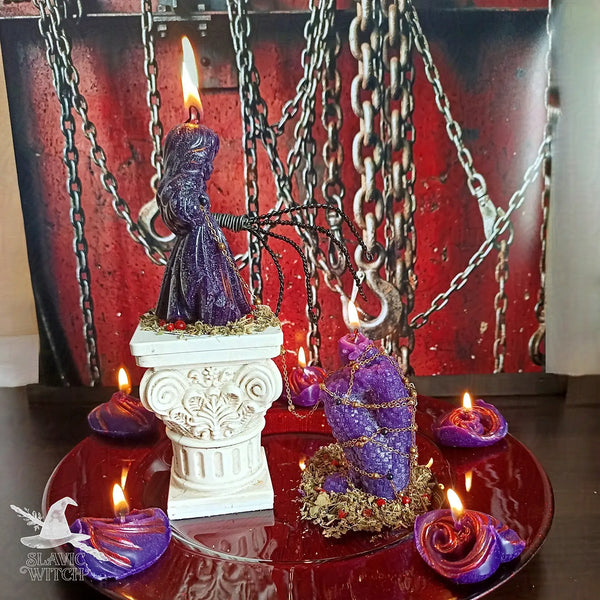 Domination spell ritual setup with purple figure candle and lit candles for the Bow Down and Worship spell by Slavic Witch